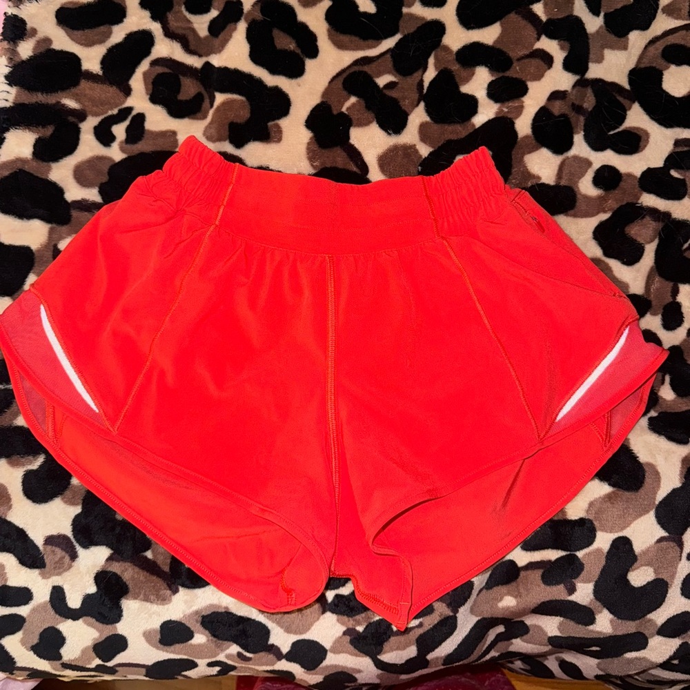 Lululemon carnation red hotty hot low rise 2.5 inch short in size 4